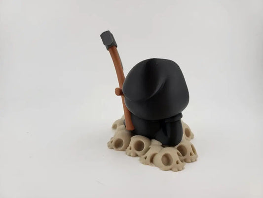 Chillin' Grim Reaper Skeleton Figure on Skull Pile My Store